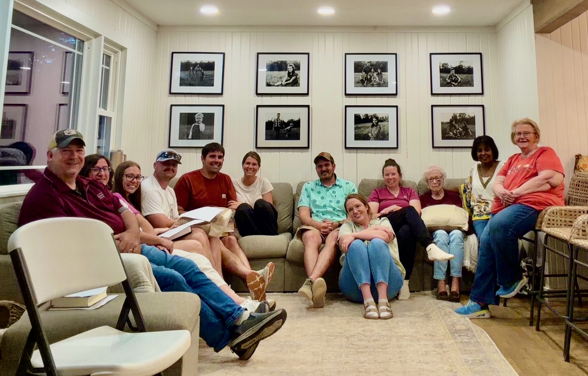 A full small group gathered in a living room